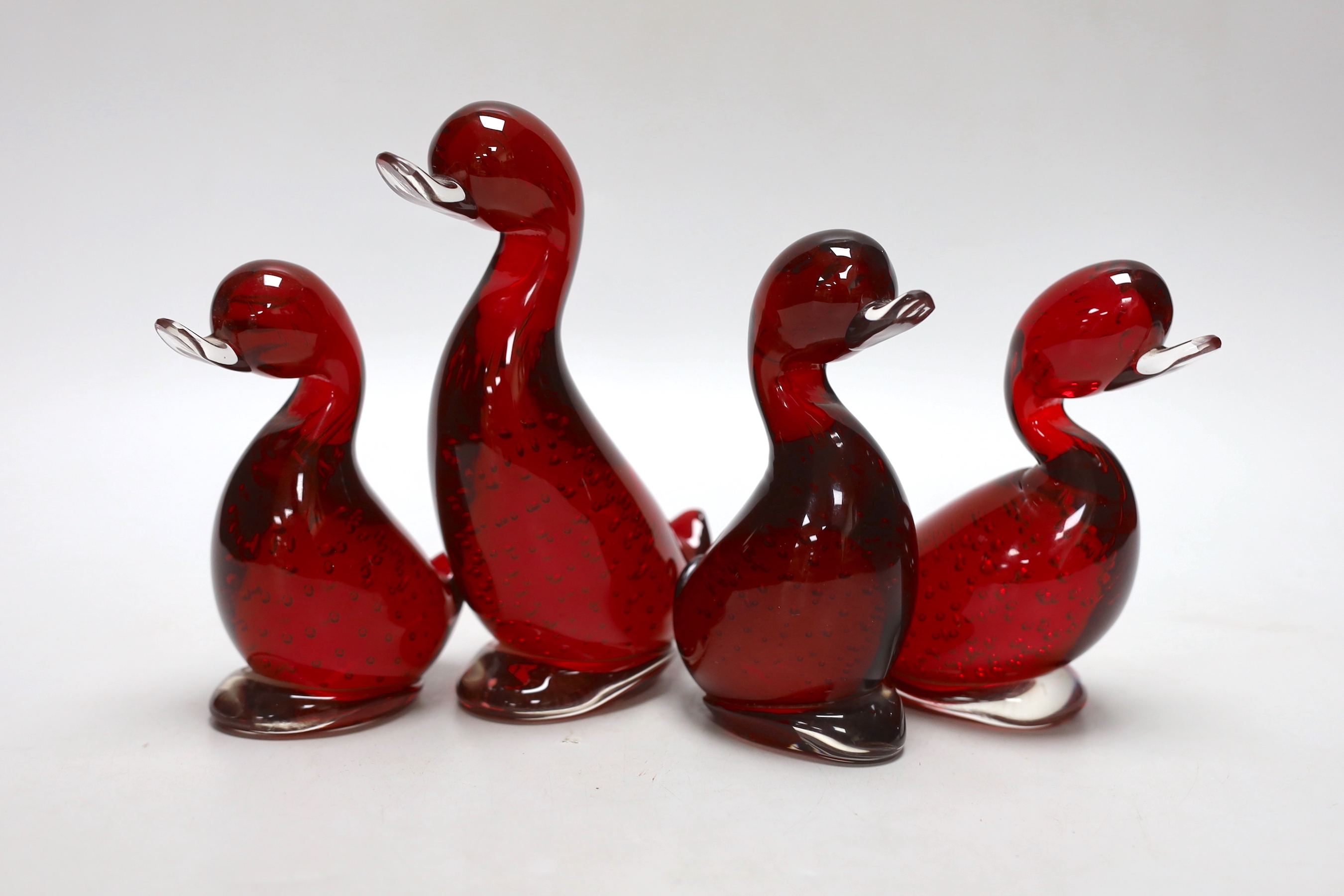 Four Whitefriars ruby glass ducks, tallest 18cm high